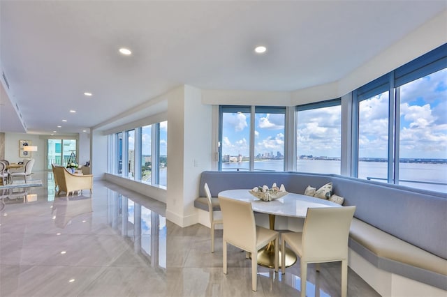 dining area featuring a water view