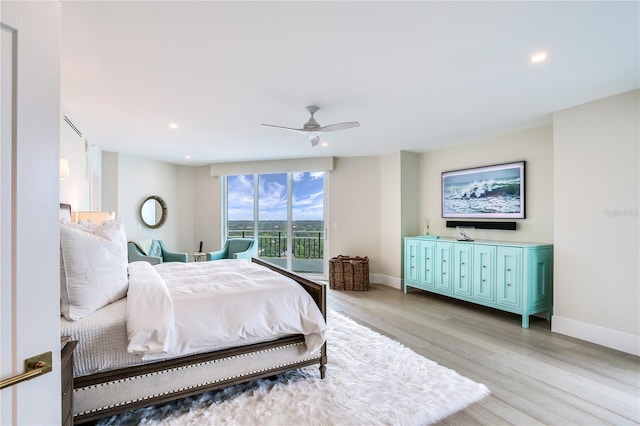 bedroom with access to exterior, ceiling fan, and light wood-type flooring