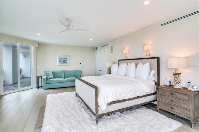 bedroom featuring light hardwood / wood-style floors and ceiling fan