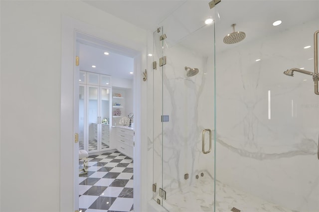 bathroom with built in shelves and an enclosed shower