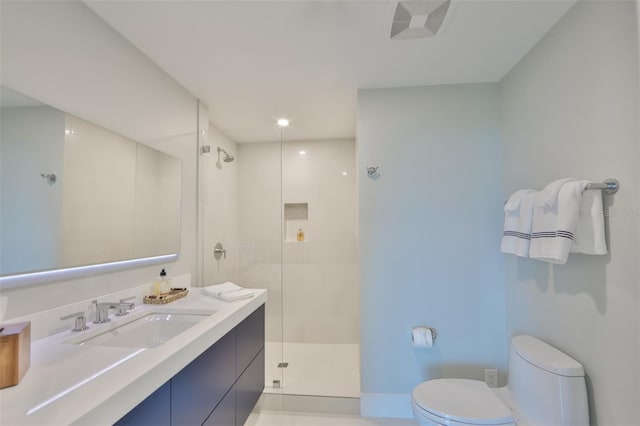 bathroom with vanity, toilet, and walk in shower