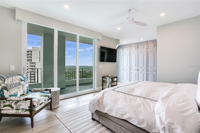 bedroom with a closet, access to exterior, ceiling fan, and light hardwood / wood-style flooring