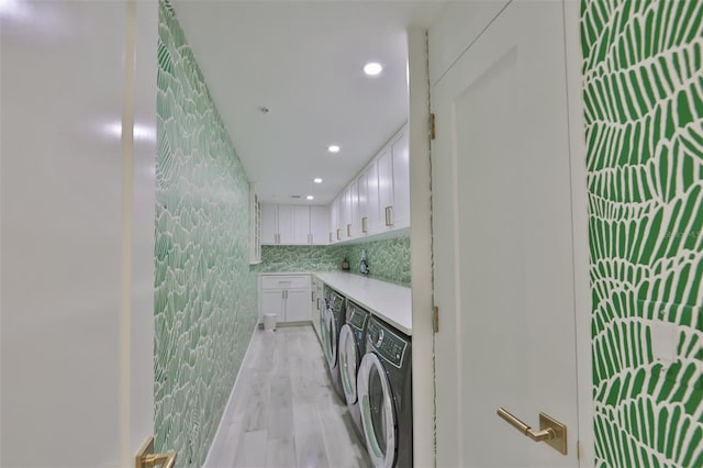 bathroom with vanity, backsplash, hardwood / wood-style flooring, and washer and clothes dryer