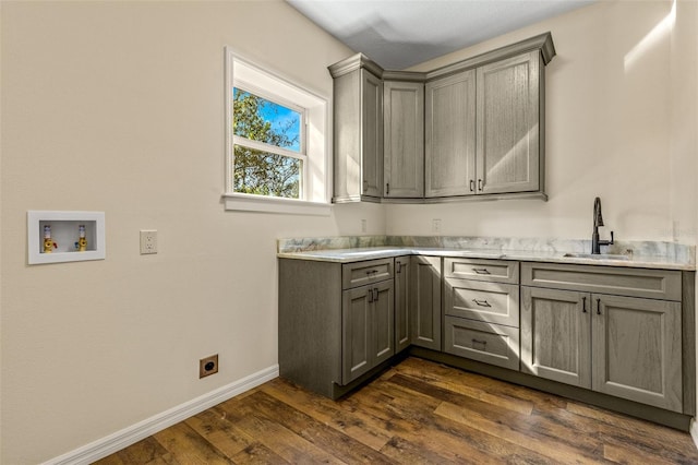 laundry room featuring cabinets, sink, washer hookup, dark hardwood / wood-style floors, and hookup for an electric dryer