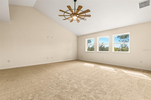 empty room featuring high vaulted ceiling, carpet floors, and ceiling fan