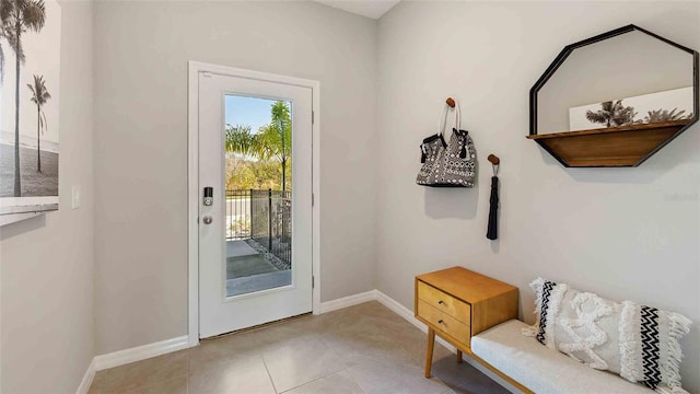 doorway with light tile patterned flooring