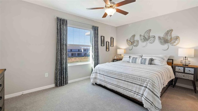 bedroom featuring ceiling fan and carpet