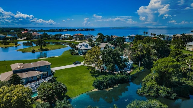 birds eye view of property with a water view