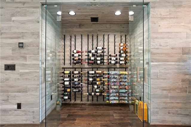 wine area with hardwood / wood-style floors