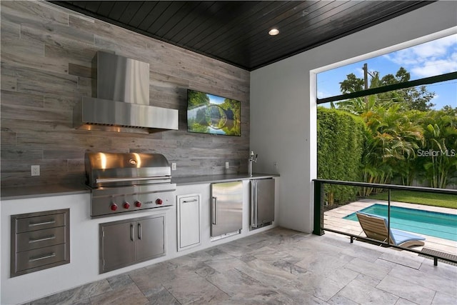 view of patio with an outdoor kitchen and area for grilling