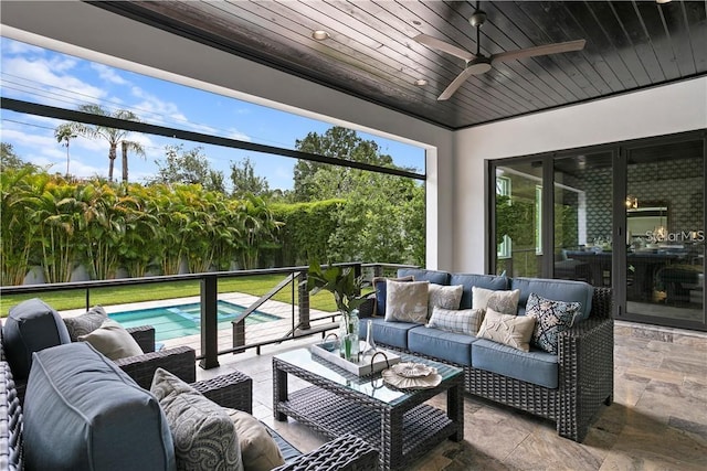 sunroom with ceiling fan and wood ceiling