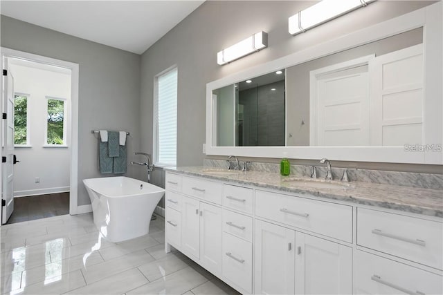 bathroom with separate shower and tub, tile patterned flooring, and vanity