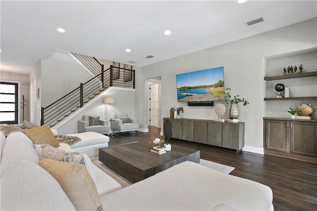 living room featuring dark hardwood / wood-style floors