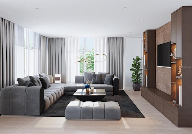 living room featuring floor to ceiling windows and light hardwood / wood-style flooring