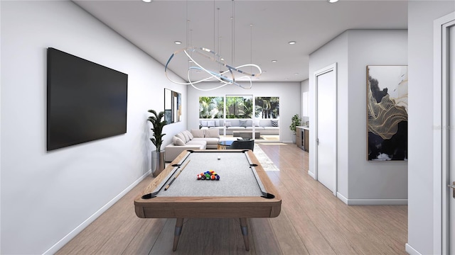 game room with light hardwood / wood-style flooring and billiards