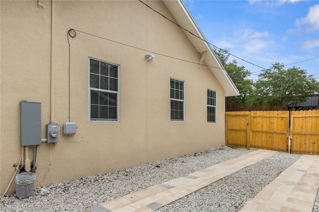 view of side of property featuring a patio