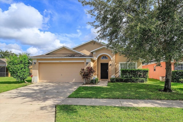 view of front of property with a garage and a front yard