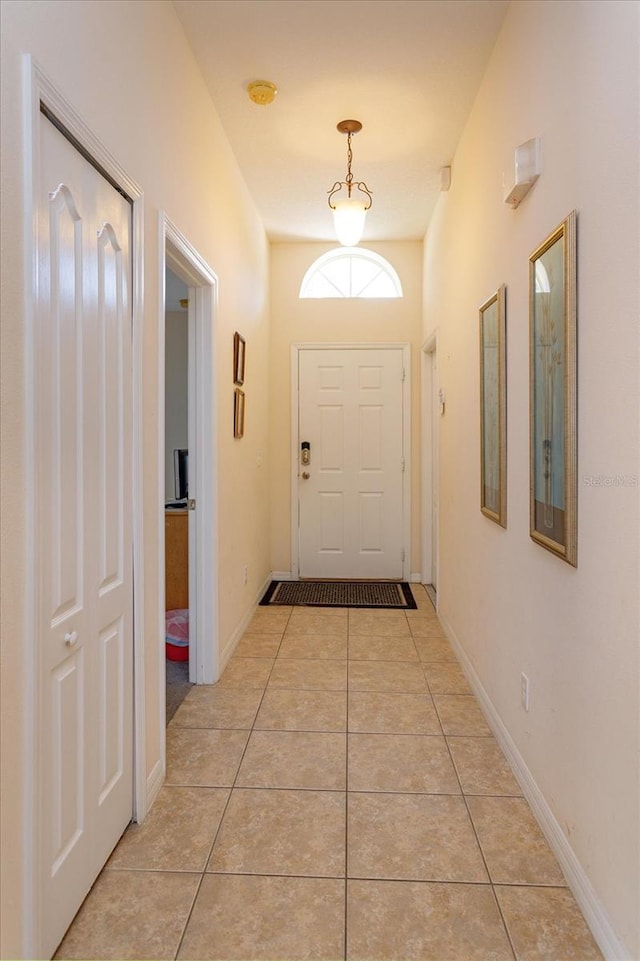 entryway with light tile patterned floors