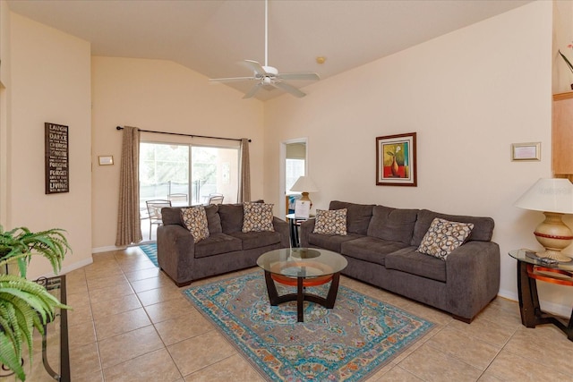 tiled living room featuring ceiling fan and vaulted ceiling