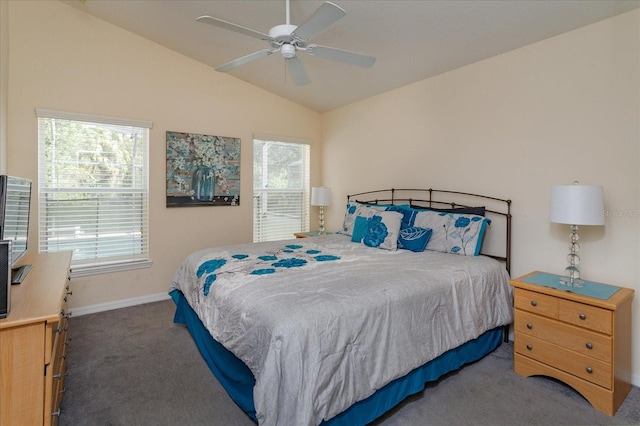 bedroom with dark colored carpet, lofted ceiling, and ceiling fan