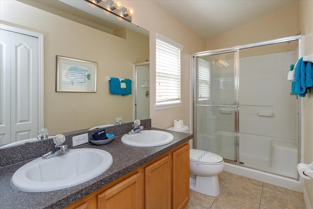 bathroom featuring lofted ceiling, an enclosed shower, vanity, tile patterned floors, and toilet