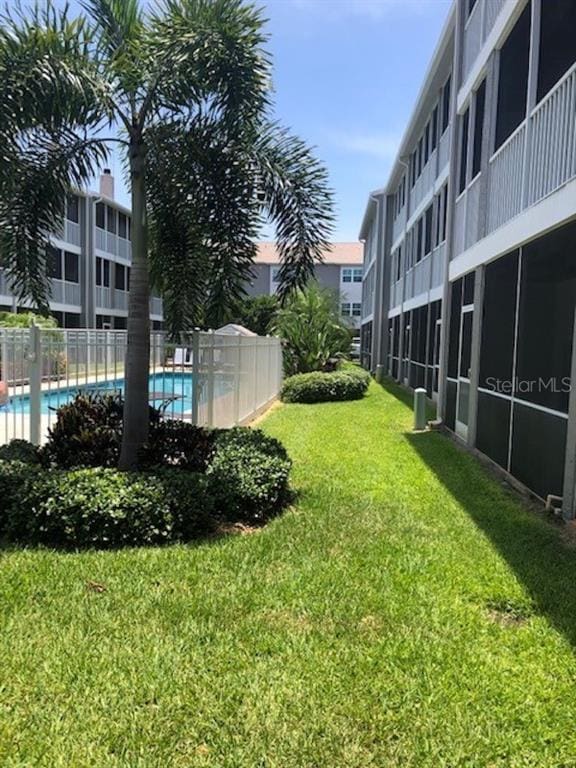 view of yard with a community pool