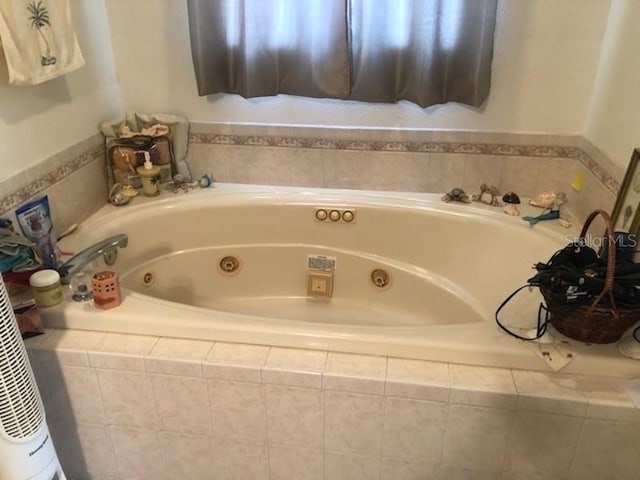 bathroom featuring tiled bath