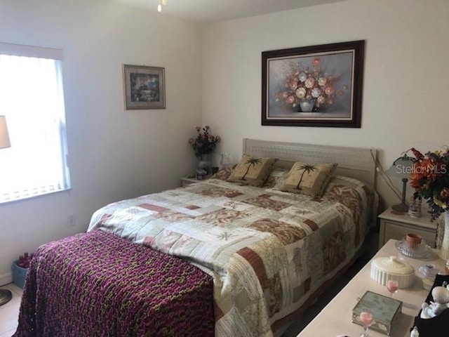 bedroom featuring multiple windows