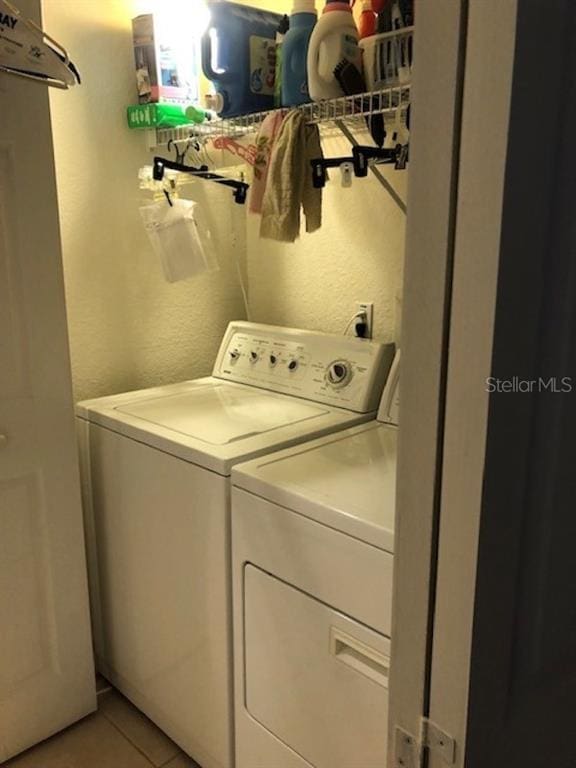 laundry room featuring separate washer and dryer