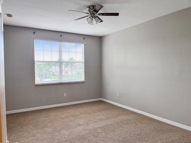 empty room with light carpet and ceiling fan