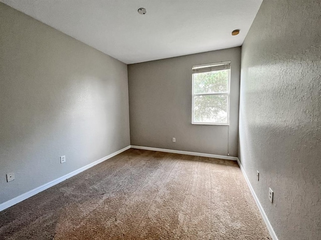 empty room with light colored carpet