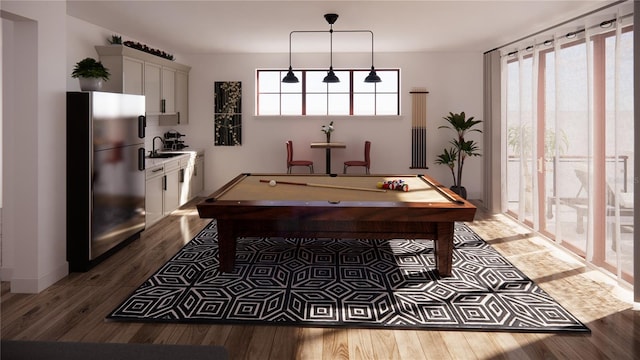 interior space with dark hardwood / wood-style floors, billiards, and sink