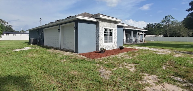 view of home's exterior with a yard and central air condition unit