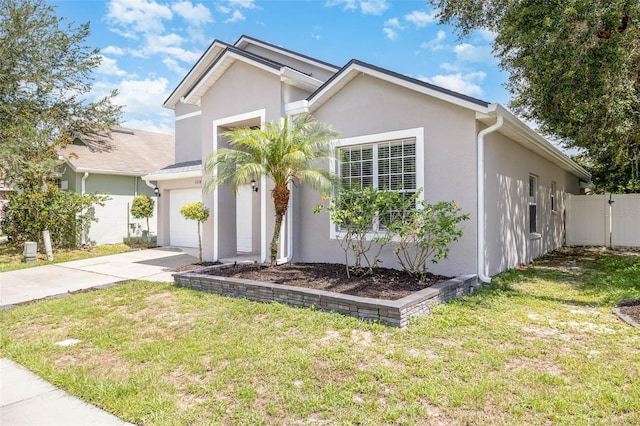 view of front of home with a garage and a front yard