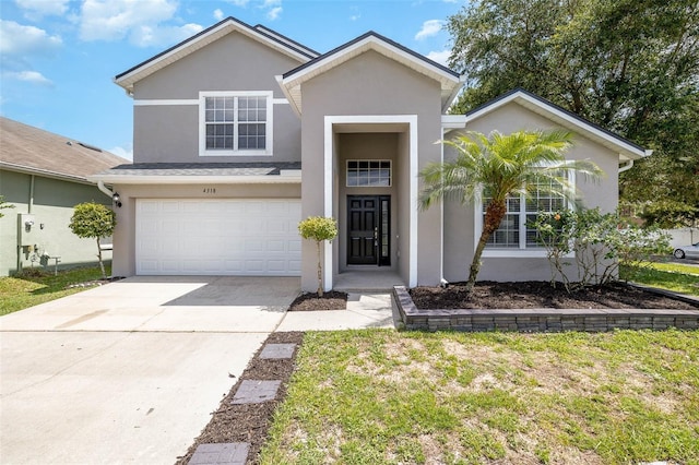 traditional-style home with stucco siding, driveway, a front lawn, and a garage