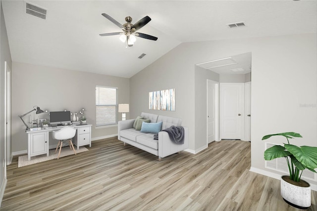 office area featuring ceiling fan, vaulted ceiling, and light wood-type flooring