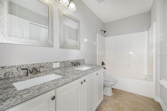 full bathroom with tile patterned flooring, vanity,  shower combination, and toilet