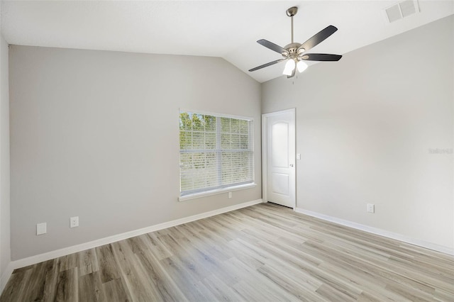 unfurnished room with ceiling fan, lofted ceiling, and light hardwood / wood-style flooring