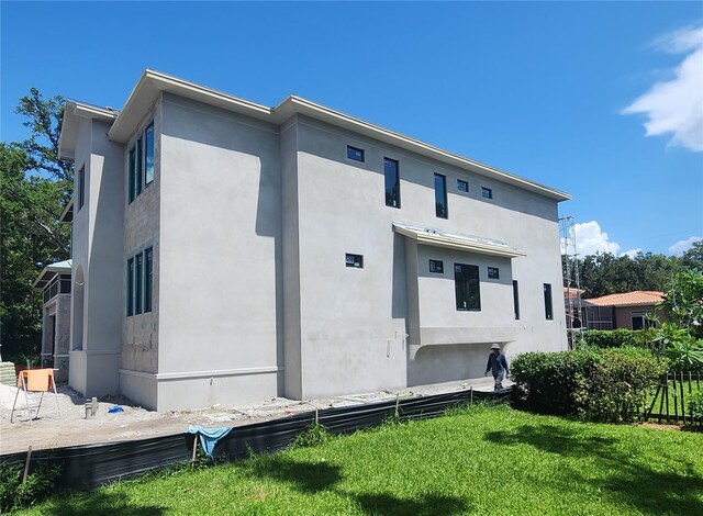 rear view of house with a lawn