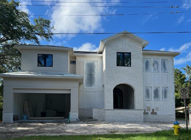 view of front of property featuring a garage