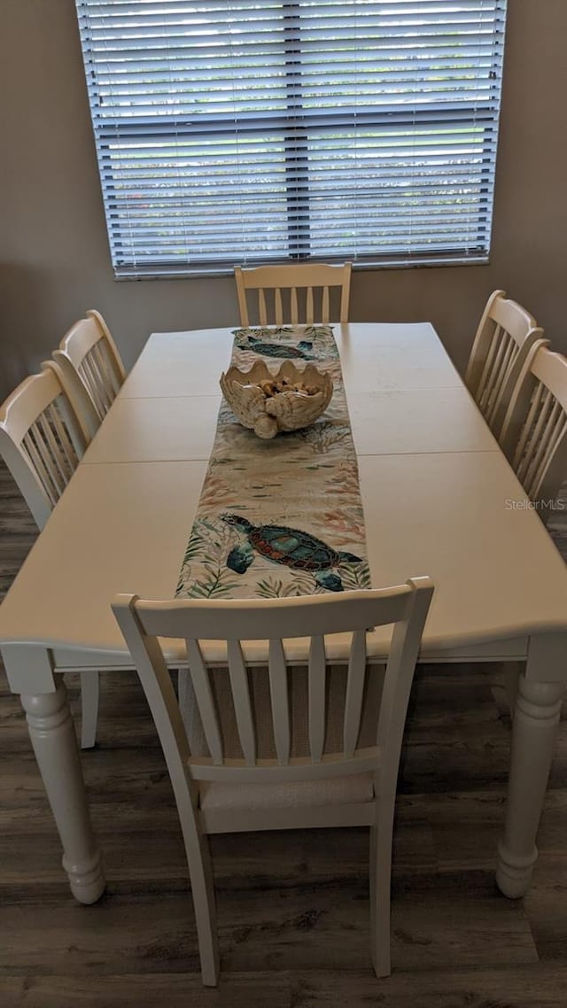 dining room featuring dark hardwood / wood-style floors and plenty of natural light