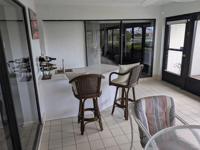 dining space featuring light tile patterned flooring