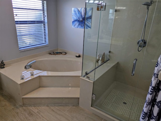 bathroom with plus walk in shower and tile patterned flooring