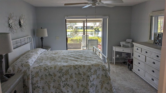 bedroom featuring light carpet, ceiling fan, multiple windows, and access to outside