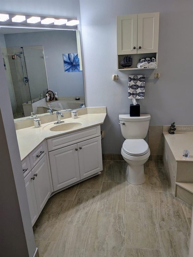 full bathroom with separate shower and tub, vanity, and toilet