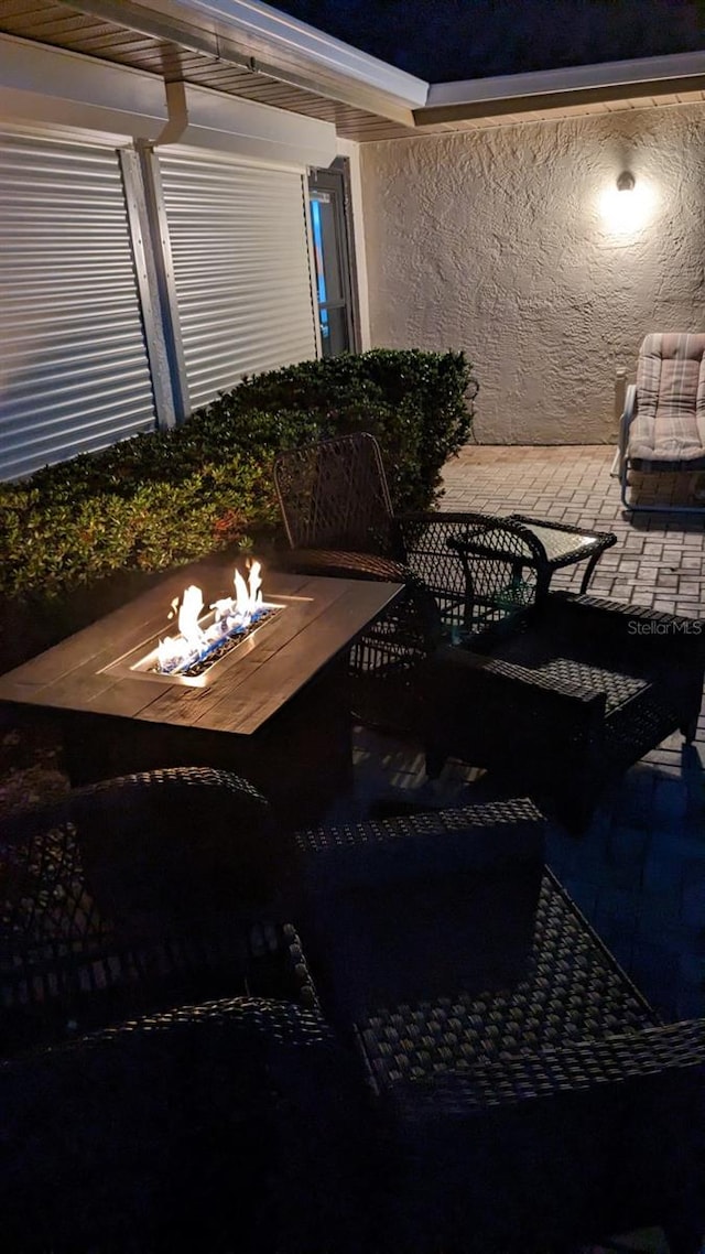 balcony featuring a patio area and an outdoor fire pit