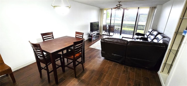 dining space featuring ceiling fan and dark hardwood / wood-style flooring