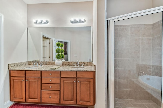 bathroom featuring independent shower and bath, dual sinks, and large vanity