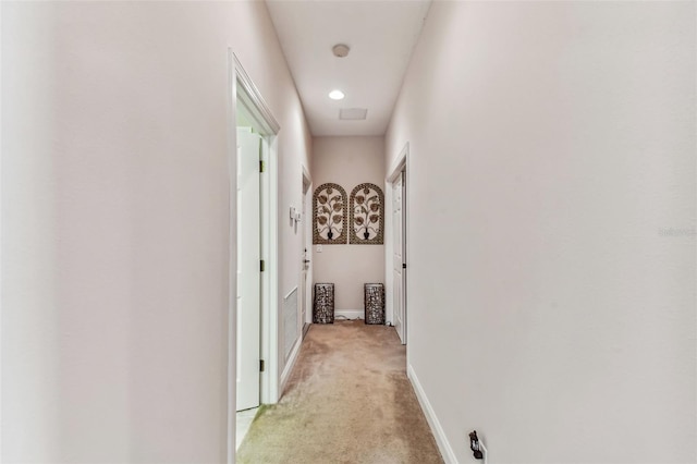 hallway with light carpet