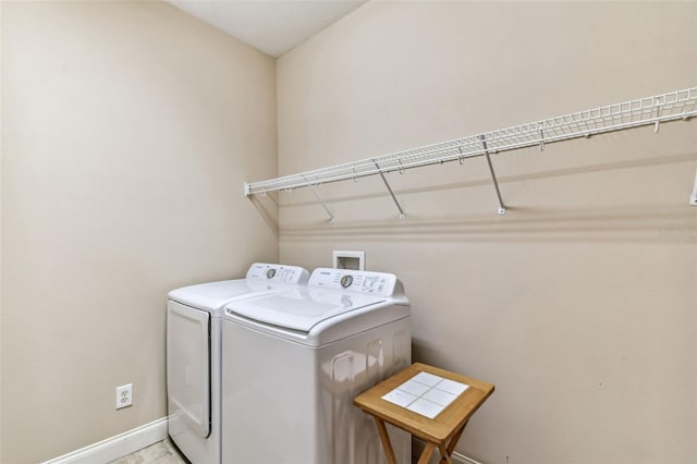 clothes washing area with separate washer and dryer and hookup for a washing machine